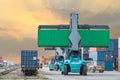 Forklift handling container box loading to freight train Royalty Free Stock Photo