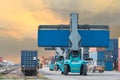 Forklift handling container box loading to freight train Royalty Free Stock Photo