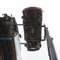Forklift hoisting car wrecks Royalty Free Stock Photo