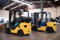 The forklift is in a large and light warehouse. Yellow color.