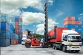 Forklift lift container box loading to truck in depot Royalty Free Stock Photo