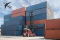 Forklift lifting container box loading to container depot with c Royalty Free Stock Photo