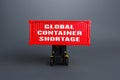 Forklift lifts the container with the inscription Global container shortage. Logistics problems due to world economy lockdowns