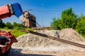 Forklift lifts the rebar bundle from ground on building site