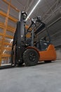 Forklift loader in new empty modern storehouse. Wide angle