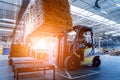 Forklift loader in storage warehouse ship yard. Distribution products. Royalty Free Stock Photo