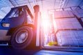 Forklift loader in storage warehouse ship yard. Distribution products. Royalty Free Stock Photo