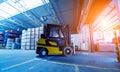 Forklift loader in storage warehouse ship yard. Distribution products. Royalty Free Stock Photo