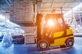 Forklift loader in storage warehouse ship yard. Distribution products. Royalty Free Stock Photo