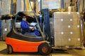 Forklift loader worker at warehouse Royalty Free Stock Photo