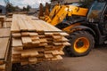 Forklift loads the boards in the lumber yard Royalty Free Stock Photo