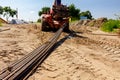 Forklift lifts the rebar bundle from ground on building site