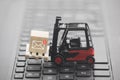 Forklift with new email graphic on wooden block over laptop keyboard Royalty Free Stock Photo