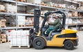 Forklift in motion at warehouse