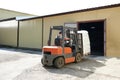 Forklift move cargo from warehouse