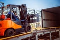 Forklift is putting cargo from warehouse to truck Royalty Free Stock Photo