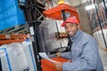 Forklift putting cargo from warehouse to truck outdoors Royalty Free Stock Photo