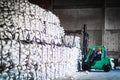 Forklift stacking up sugar bag inside warehouse, sugar warehouse operation. Agriculture product storing and logistics for import a Royalty Free Stock Photo