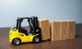 Forklift stacks wooden crates. Transportation industry.