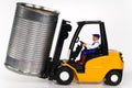 Forklift and tin can Royalty Free Stock Photo