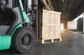 Forklift Tractor Loading Wooden Crates into Cargo Container. Distributions Warehouse. Supply Chain. Warehouse Shipping Cargo.