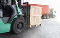 Forklift Tractor Unloading Wooden Crates at Warehouse. Truck Loading Dock Warehouse. Shipment Supplies Warehouse Shipping Royalty Free Stock Photo