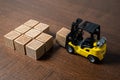 A forklift transports and places boxes. Order for shipment. Production and freight of goods. Increase in imports and exports. The Royalty Free Stock Photo