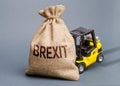 The forklift truck cannot budge the bag Brexit. UK withdrawal from the EU without deal agreement. A difficult political situation Royalty Free Stock Photo