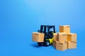 Forklift truck with cardboard boxes. Transportation logistics infrastructure, import and export goods and products delivery. Produ