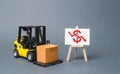 Forklift truck carries a cardboard box near a stand with a red dollar arrow down. decline in the production of goods and products Royalty Free Stock Photo