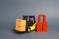 Forklift truck carries a cardboard box next to red padlock. Embargo, trade wars. No delivery. Restriction on the importation Royalty Free Stock Photo