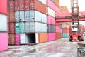 forklift truck Container boxes in a logistics yard with a stack of containers in the background Royalty Free Stock Photo