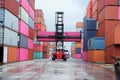 forklift truck Container boxes in a logistics yard with a stack of containers in the background Royalty Free Stock Photo