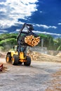 Forklift truck hauling logs at sawmill Royalty Free Stock Photo
