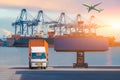 Forklift truck lifting cargo container in shipping yard or dock yard against sunrise sky for transportation import Royalty Free Stock Photo