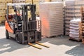 Forklift trucks for moving goods in warehouses.