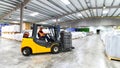 Forklift trucks transported in a warehouse - storage of goods in