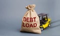 Forklift unable to pick up a bag with the inscription Debt Load. Debt burden, financial difficulties in repayment. Credit