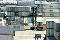 Forklift unloading larger containers Royalty Free Stock Photo