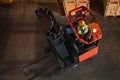 Forklift with worker in operation in storage warehouse