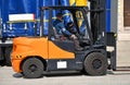 Forklift works next to a truck