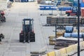 Forklift works in an open warehouse in the seaport. Royalty Free Stock Photo