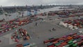 Forklifts driving around cargo container terminal in Hamburg port