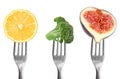 Forks with different vegetables and fruits on background. Healthy meal