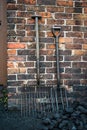 Old forks for moving coal, outside a colliers house. Royalty Free Stock Photo