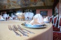 Forks and plates with placemat at dinner table