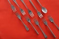 Forks and spoon on color background, flat lay Royalty Free Stock Photo