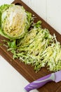 Forks young cabbage on a cutting board and knife