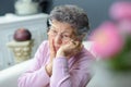 Forlorn elderly lady sitting alone Royalty Free Stock Photo