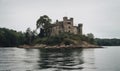 The forlorn old castle rested on a small, deserted island Creating using generative AI tools Royalty Free Stock Photo